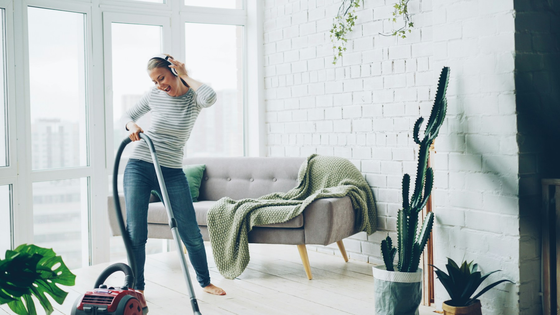 Standard house cleaning Chicago: Blue Line Cleaning vacuuming a bright living room